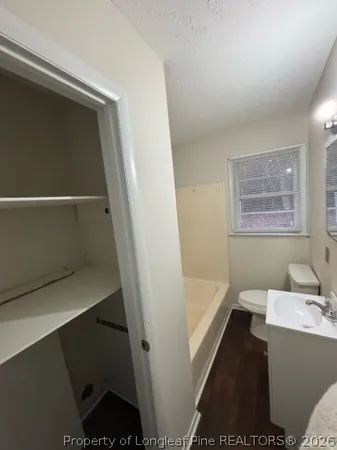 a bathroom with a bathtub and sink