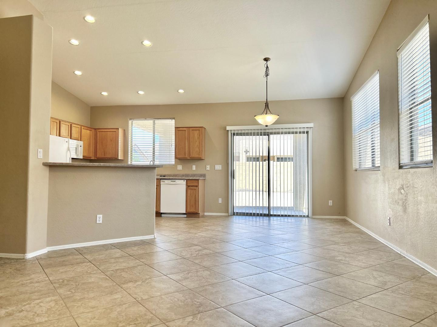 6660 East Roland Street Mesa, AZ 85215 - Photo 4 of 17 a view of a kitchen with a sink and cabinets
