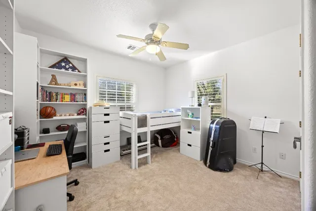 a view of workspace with furniture and window