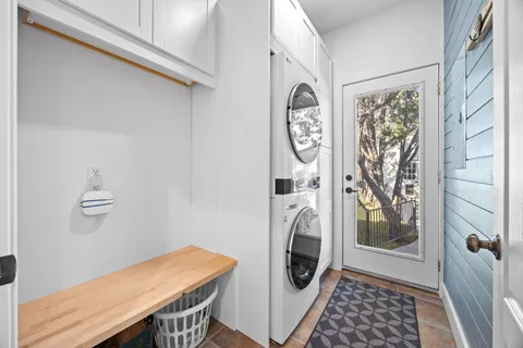 a view of a storage and utility room with washer and dryer
