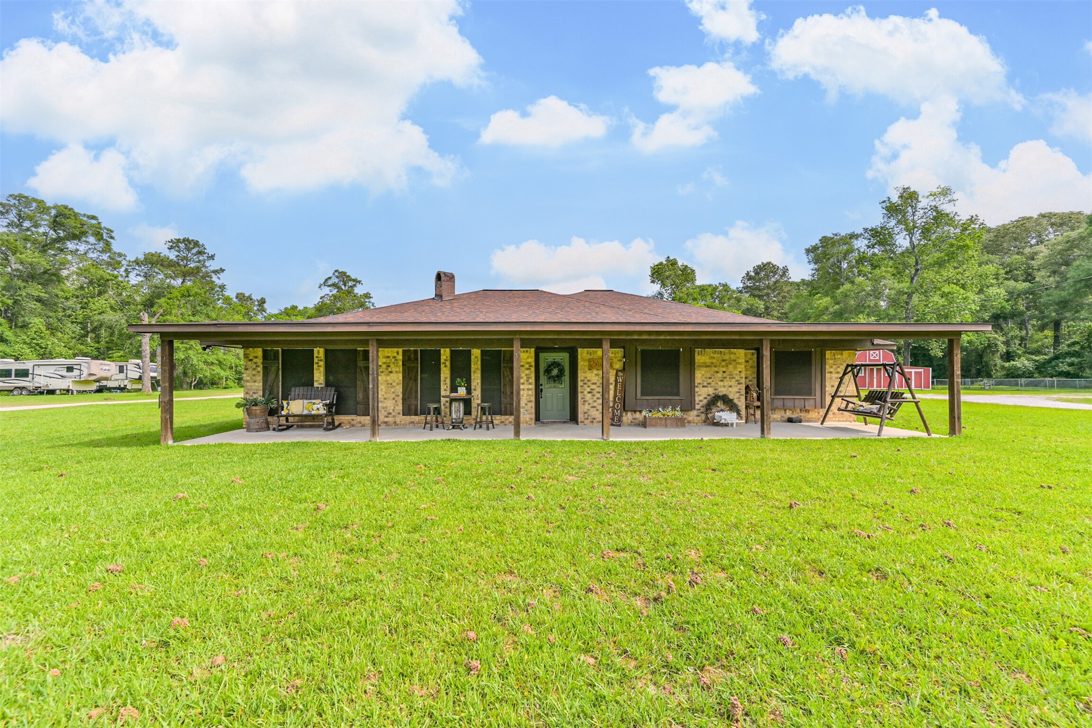 a front view of a house with table and chairs