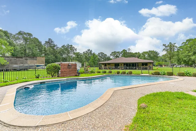 a view of a swimming pool with a lounge chairs