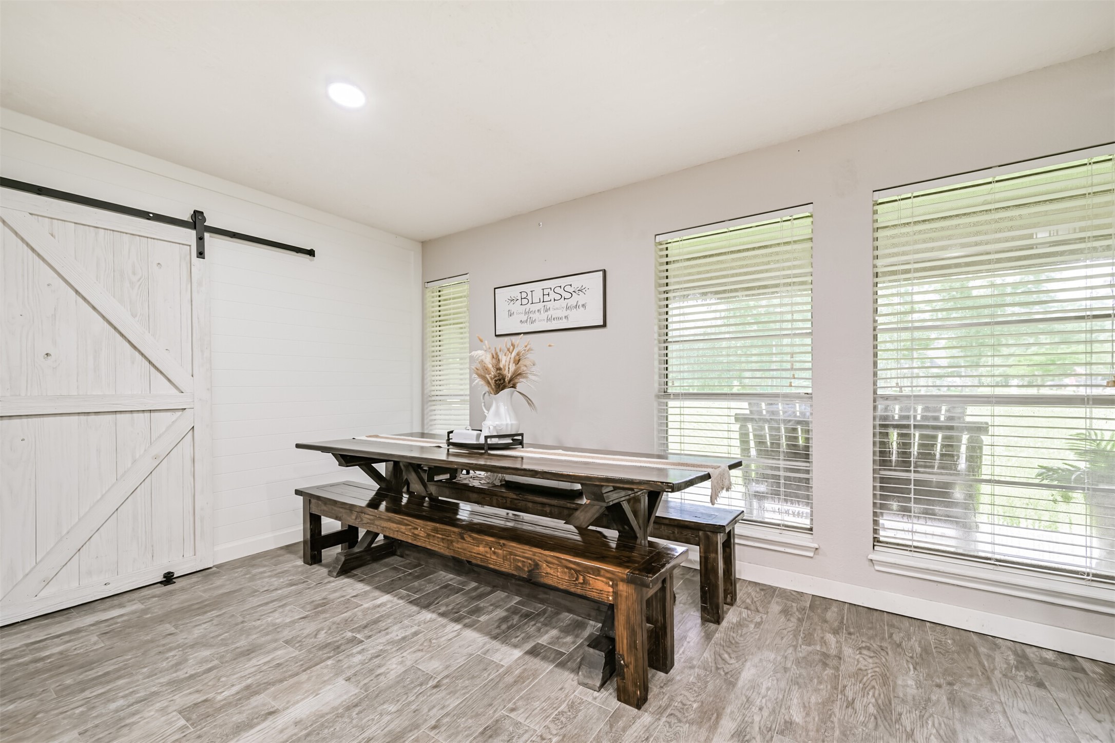 26925 Brentwood Road Splendora, TX 77372 - Photo 20 of 30 a living room with furniture a rug and a large window