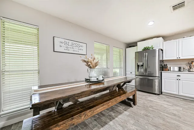 a kitchen with a sink appliances and cabinets