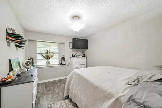 a bedroom with a bed and furniture