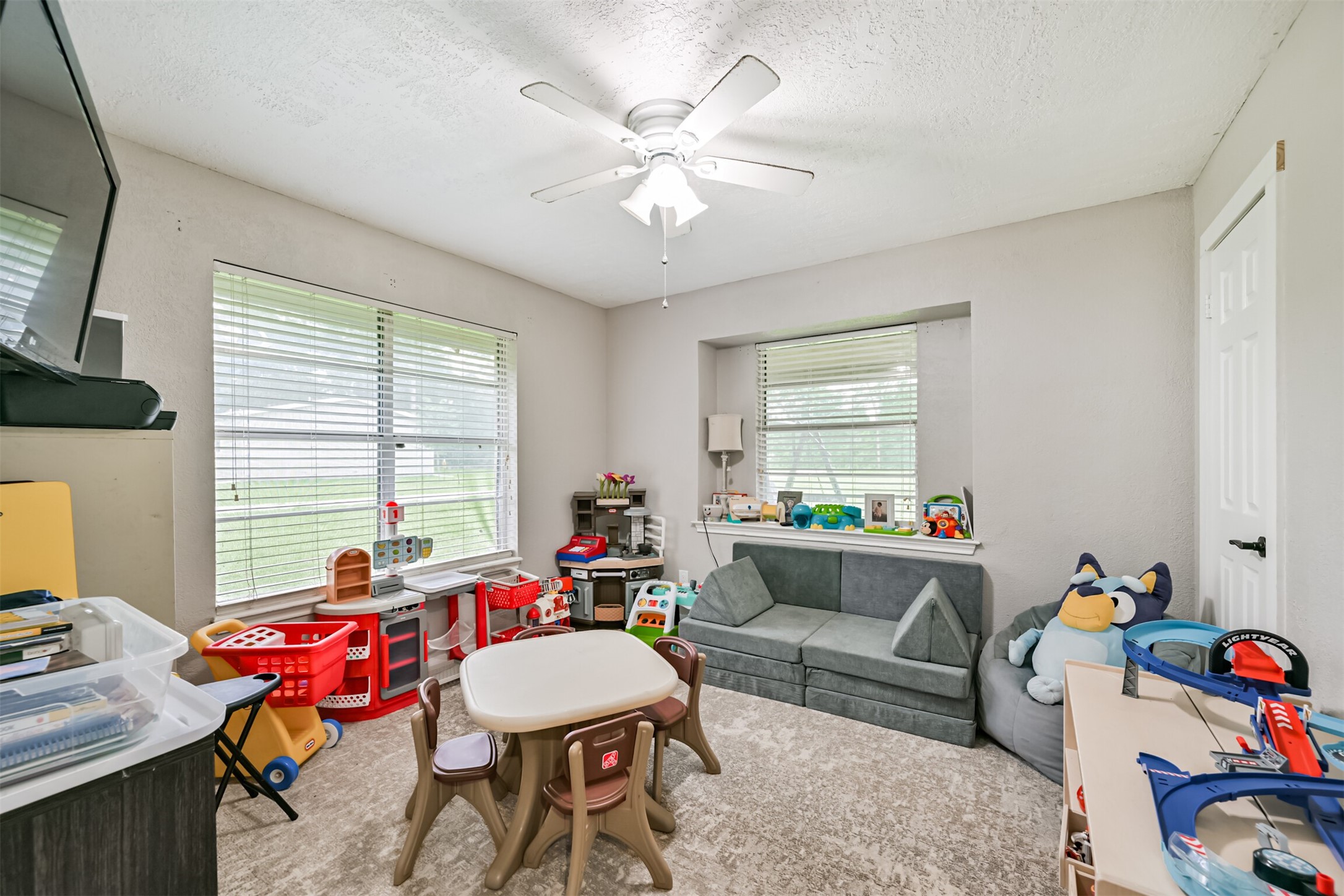 26925 Brentwood Road Splendora, TX 77372 - Photo 26 of 30 a living room with furniture and a window