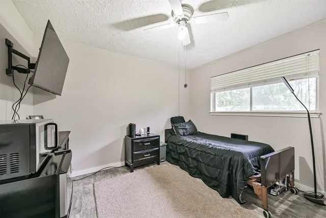 a bedroom with furniture and a window
