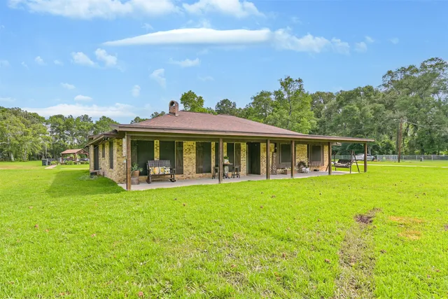 a front view of house with yard porch and green space