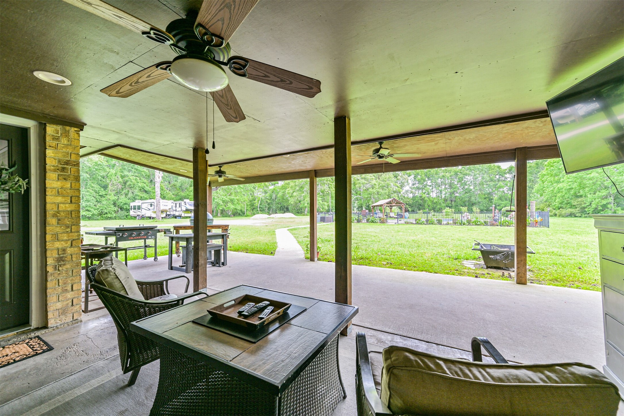 26925 Brentwood Road Splendora, TX 77372 - Photo 9 of 30 a living room with large window and a table