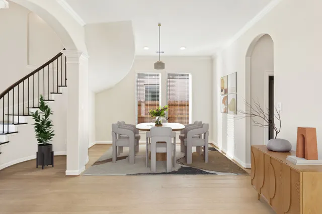 a view of a dining room with furniture window and wooden floor