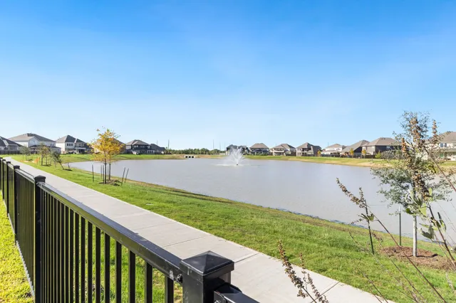 a view of lake and houses with outdoor space