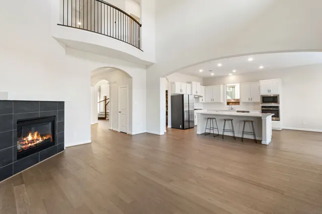 a view of kitchen with furniture and a fireplace