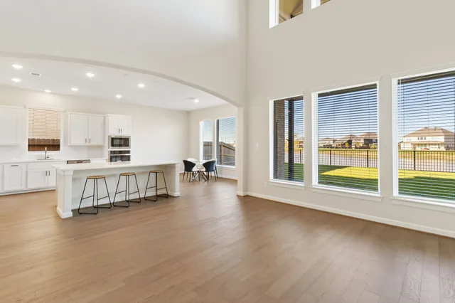 a open kitchen with a large window and a counter top space