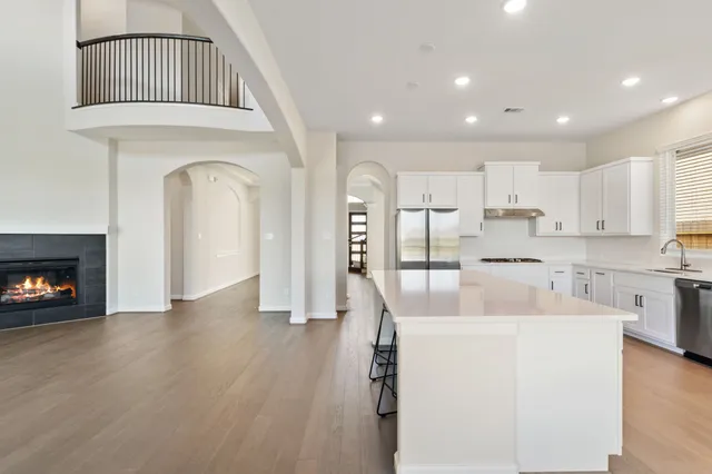 a view of kitchen with sink and wooden floor