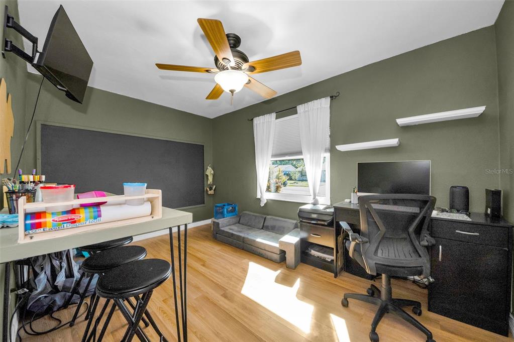 8037 Powder Horn Circle Largo, FL 33773 - Photo 15 of 27 a living room with furniture and a wooden floor