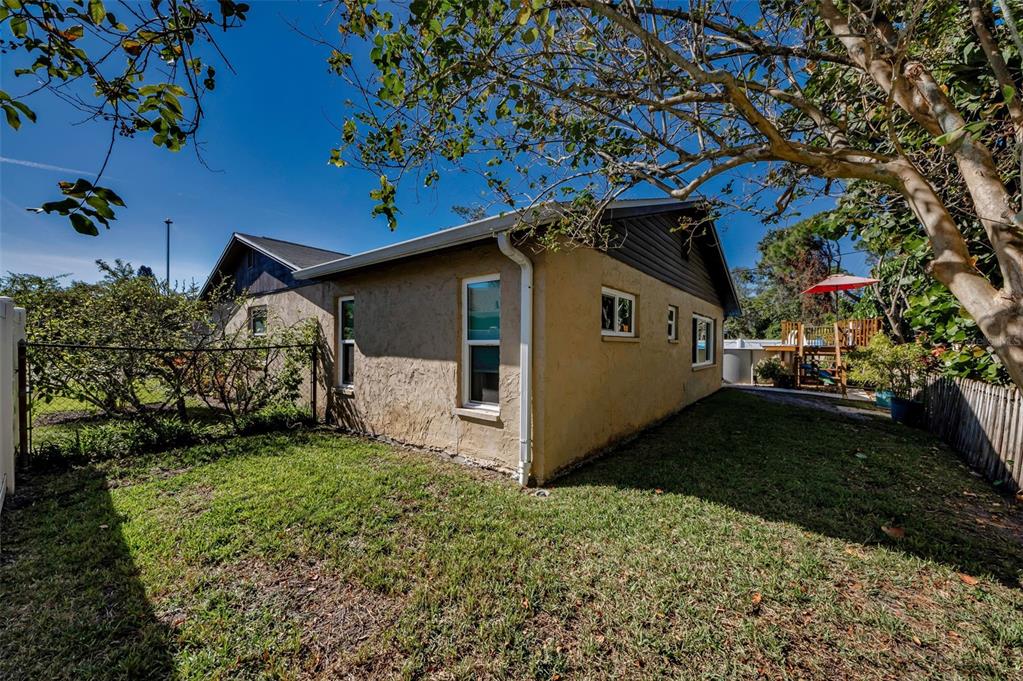 8037 Powder Horn Circle Largo, FL 33773 - Photo 19 of 27 a view of a house with a yard