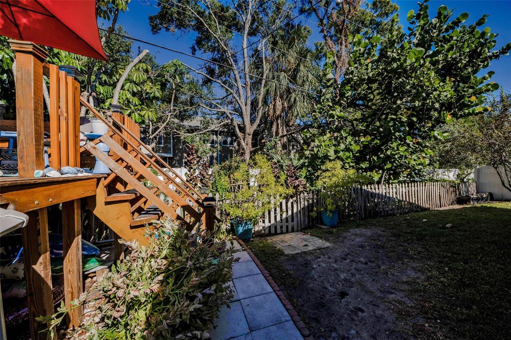 8037 Powder Horn Circle Largo, FL 33773 - Photo 21 of 27 a backyard of a house with lots of green space