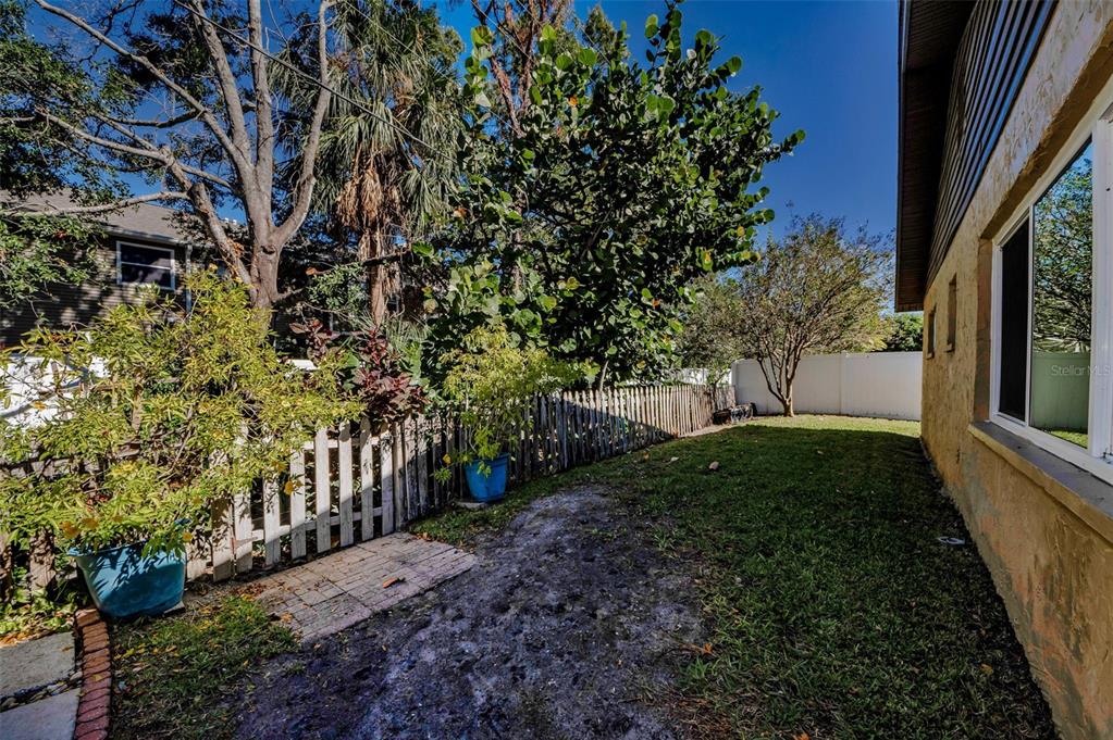 8037 Powder Horn Circle Largo, FL 33773 - Photo 23 of 27 a view of a yard with plants and trees