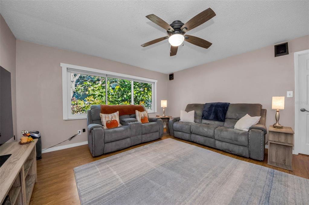 8037 Powder Horn Circle Largo, FL 33773 - Photo 4 of 27 a living room with furniture and a large window