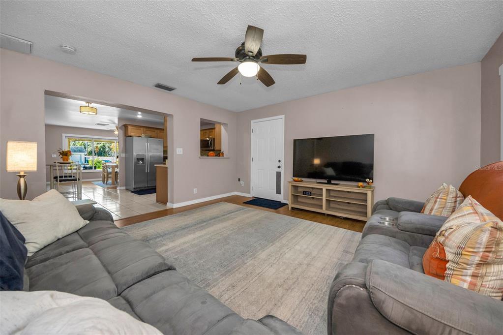 8037 Powder Horn Circle Largo, FL 33773 - Photo 5 of 27 a living room with furniture and a flat screen tv