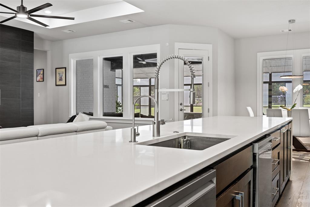 1730 Lone Elm Road Waxahachie, TX 75167 - Photo 16 of 40 a kitchen with a sink and refrigerator