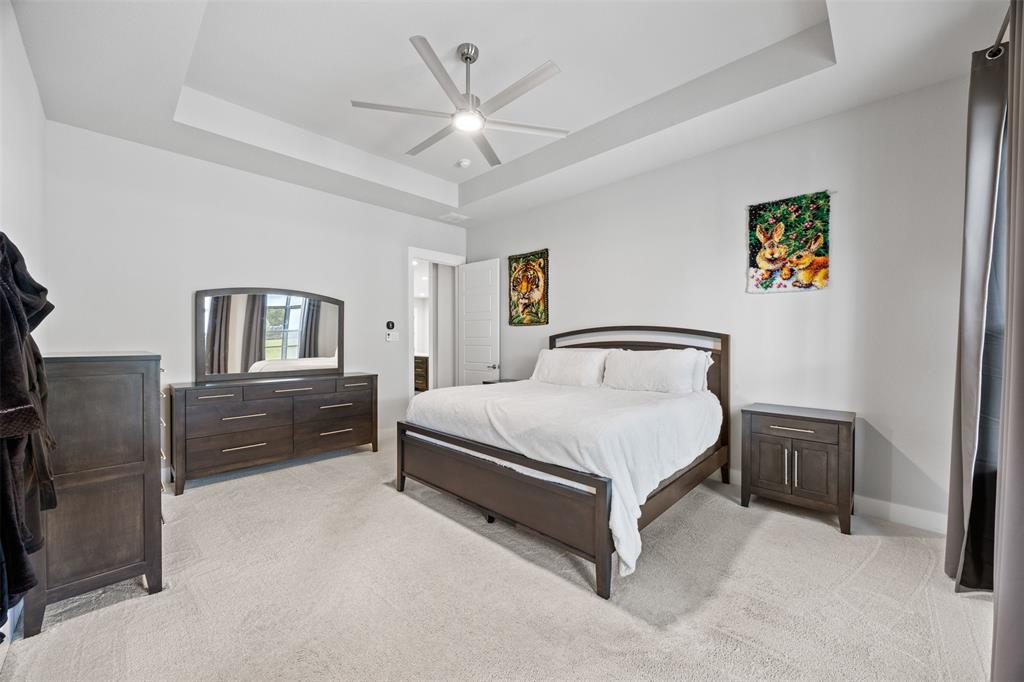 1730 Lone Elm Road Waxahachie, TX 75167 - Photo 22 of 40 a bedroom with a bed dresser and a window