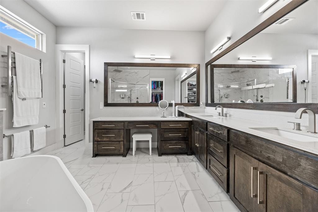 1730 Lone Elm Road Waxahachie, TX 75167 - Photo 27 of 40 a spacious bathroom with a granite countertop sink mirror and a