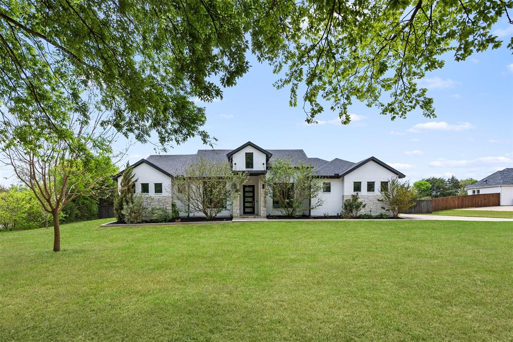 1730 Lone Elm Road Waxahachie, TX 75167 - Photo 4 of 40 a view of a house with a yard and large trees