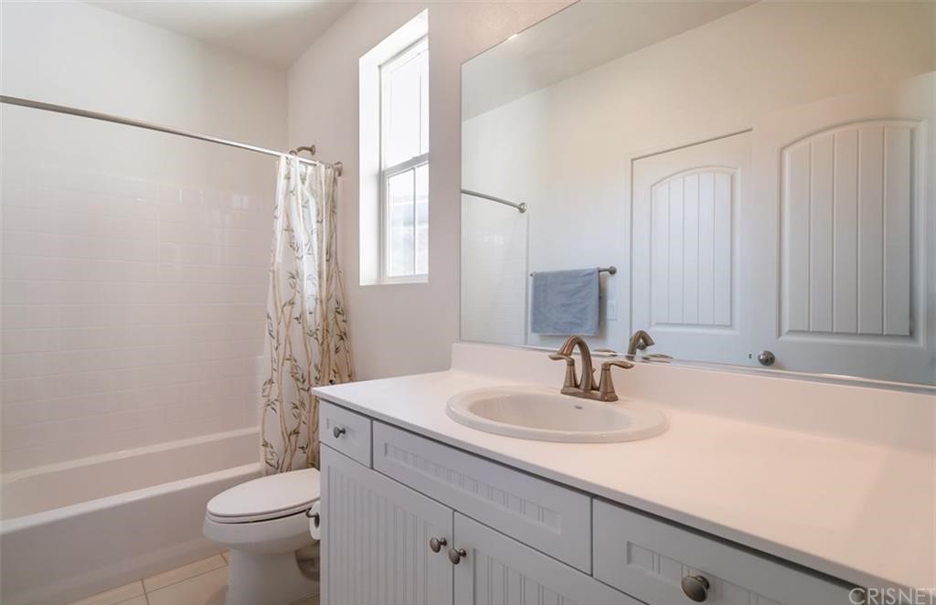 22166 Barrington Way Saugus, CA 91350 - Photo 13 of 19 a bathroom with a sink toilet and shower