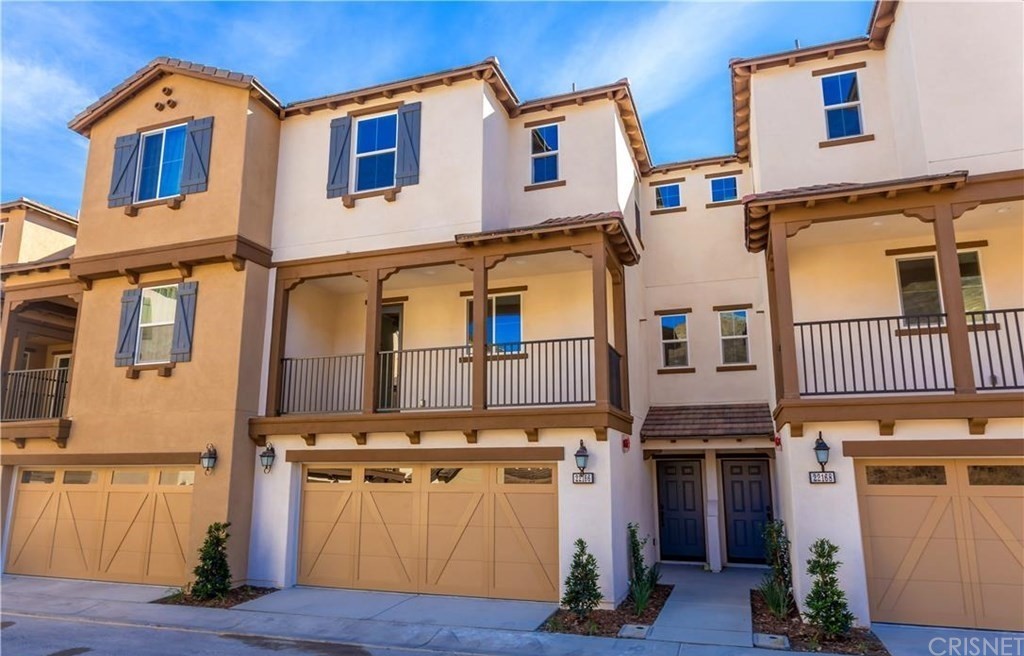 22166 Barrington Way Saugus, CA 91350 - Photo 2 of 19 a front view of a house with a garage