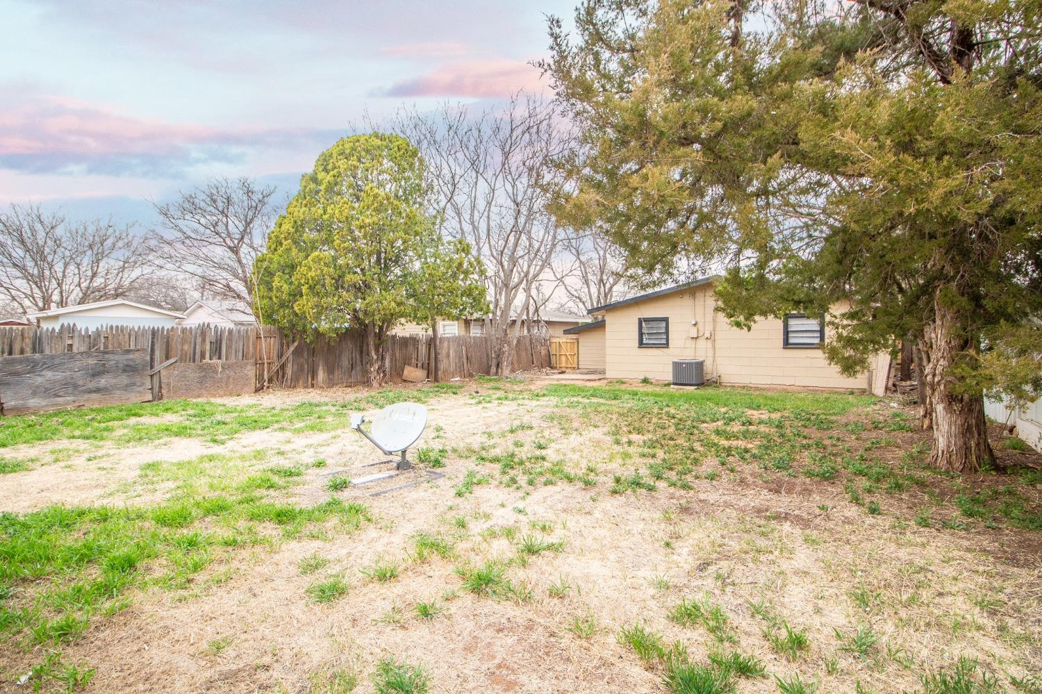 5105 39th Street Lubbock, TX 79414 - Photo 18 of 18 a house with trees in front of it