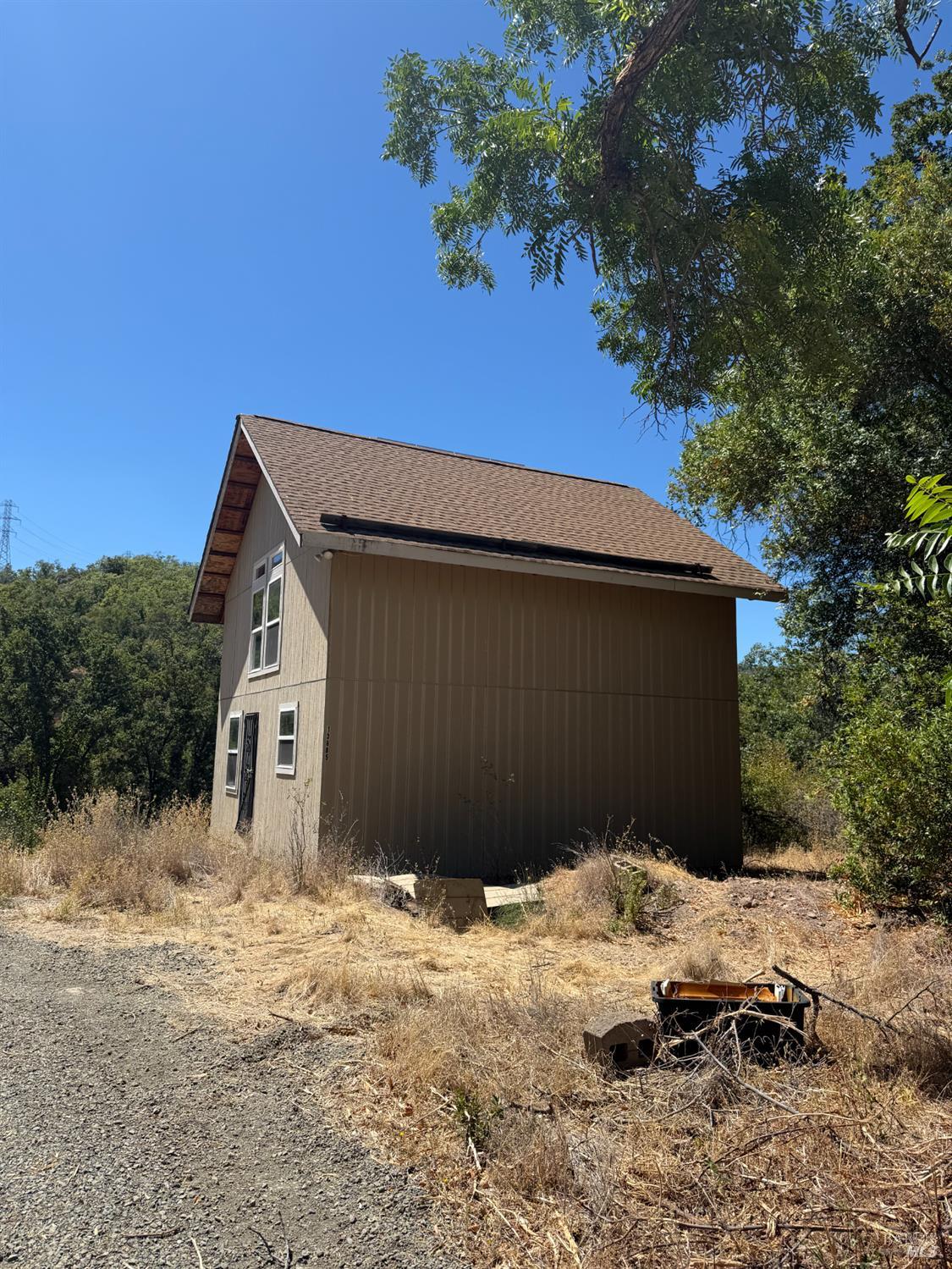 13200 Seigler Canyon Road Lower Lake, CA 95457 - Photo 24 of 30 a backyard of a house with wooden fence