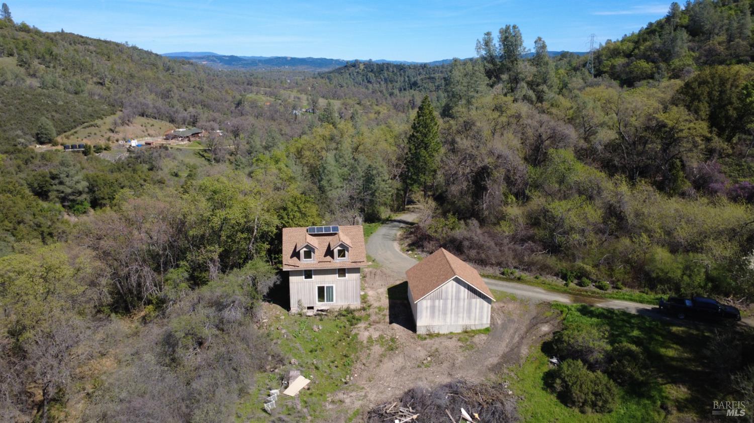 13200 Seigler Canyon Road Lower Lake, CA 95457 - Photo 3 of 30 an aerial view of a house with a yard