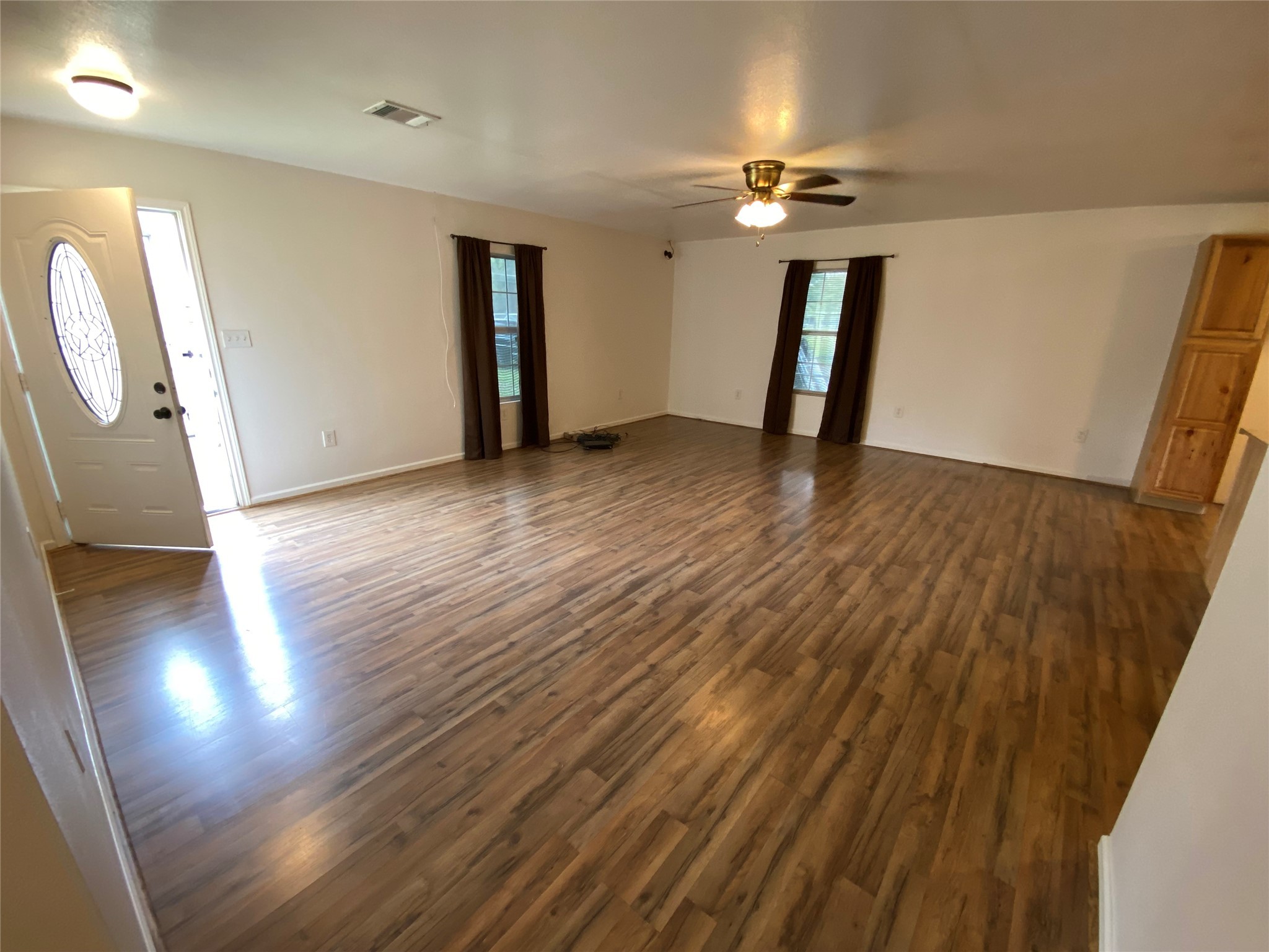 20672 Trinity Way New Caney, TX 77357 - Photo 13 of 41 wooden floor in an empty room with a mirror