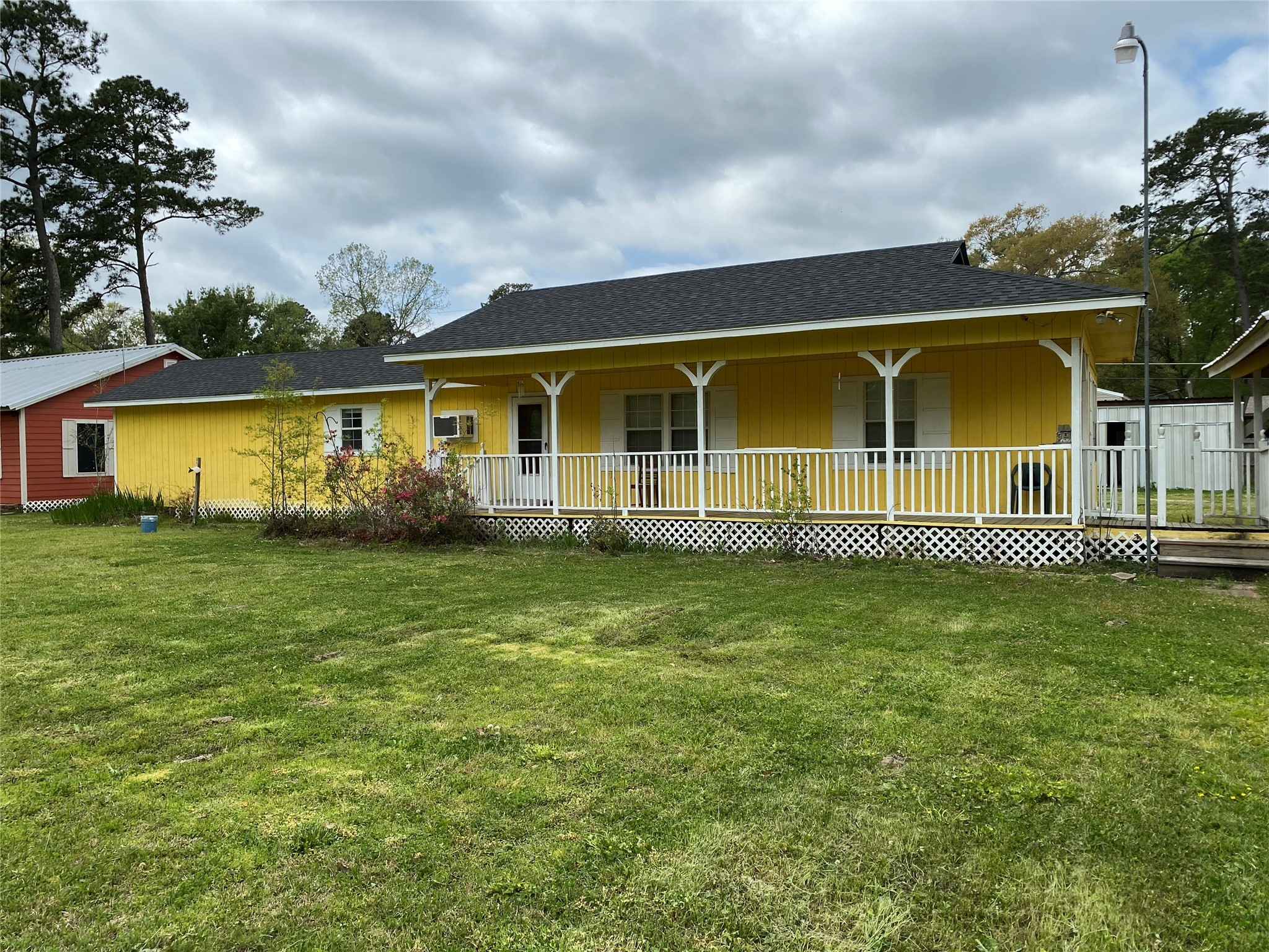 20672 Trinity Way New Caney, TX 77357 - Photo 16 of 41 a front view of a house with a garden