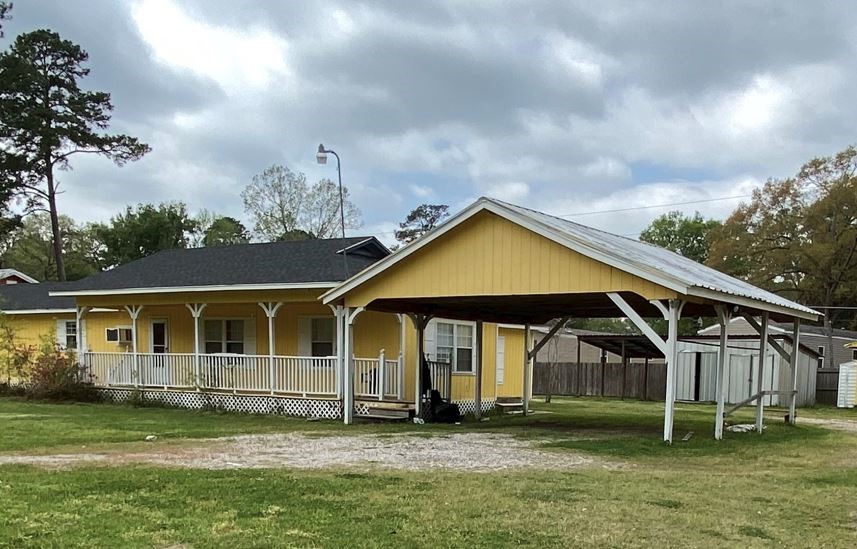 20672 Trinity Way New Caney, TX 77357 - Photo 17 of 41 a view of a house with a yard