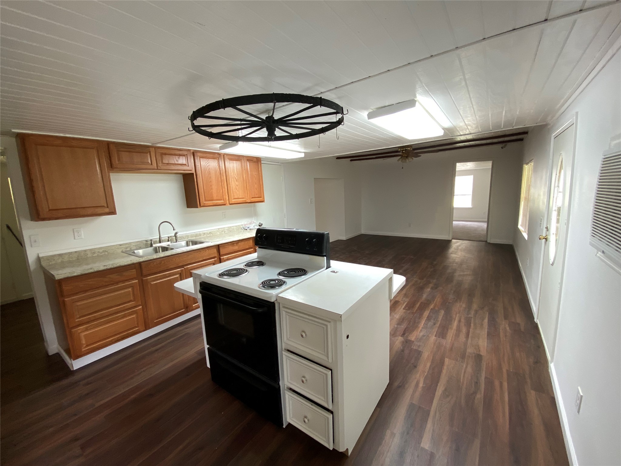 20672 Trinity Way New Caney, TX 77357 - Photo 20 of 41 a kitchen with a stove and wooden floor