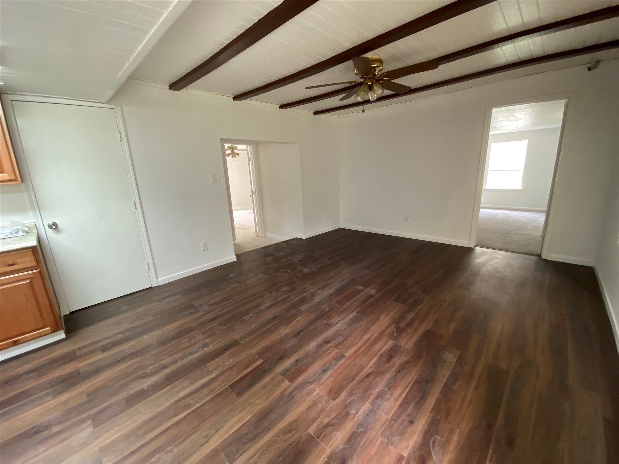20672 Trinity Way New Caney, TX 77357 - Photo 21 of 41 a view of a room with wooden floor and white walls