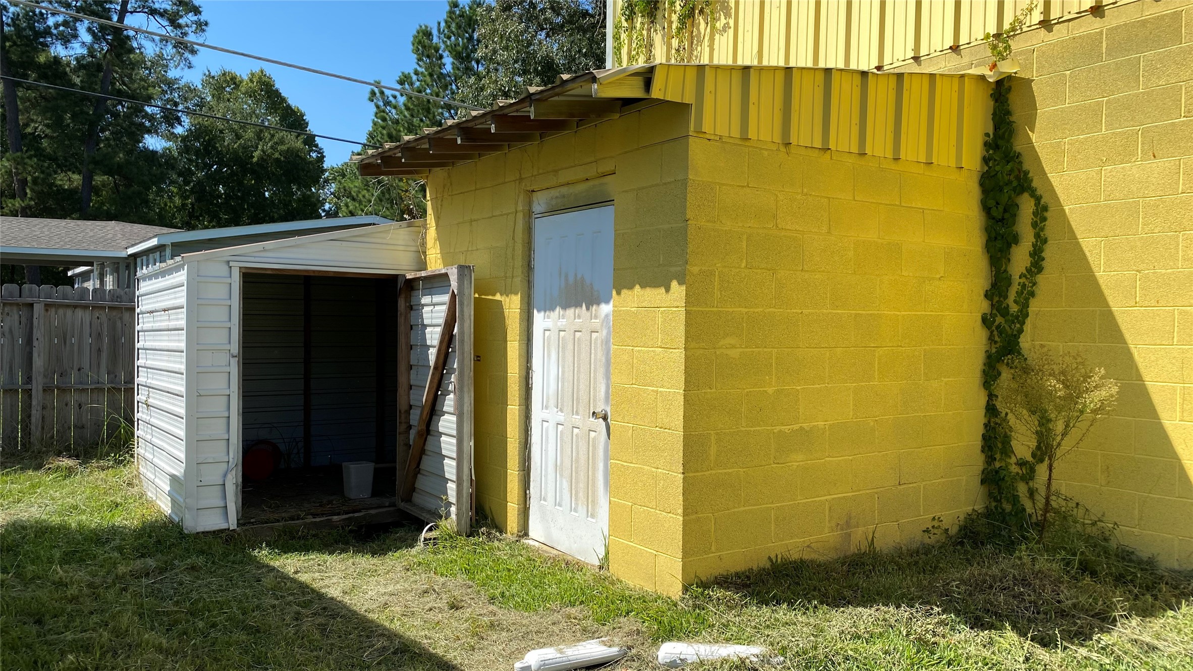20672 Trinity Way New Caney, TX 77357 - Photo 36 of 41 a view of a small house with backyard