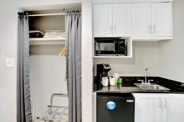 a kitchen with a sink and cabinets