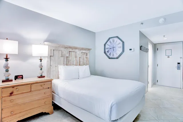 a bedroom with a large bed and a large closet