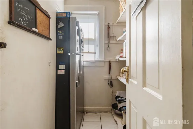 a bedroom with a bed and flat screen tv
