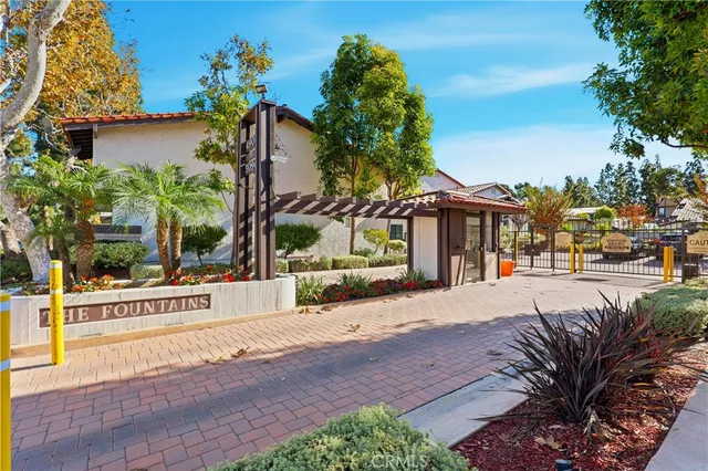 a view of a house with outdoor space and parking