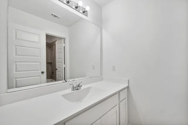 a bathroom with a shower and a toilet