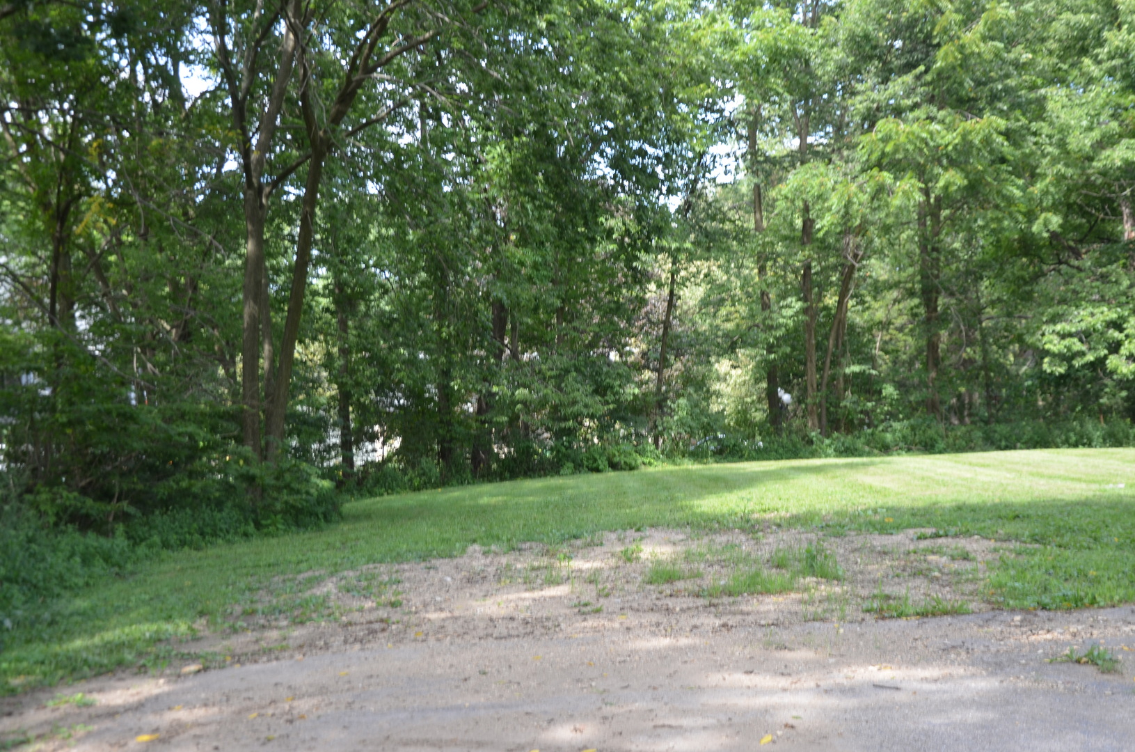170 Chicago Road Oswego, IL 60543 - Photo 4 of 9 a view of a grassy field with trees in the background