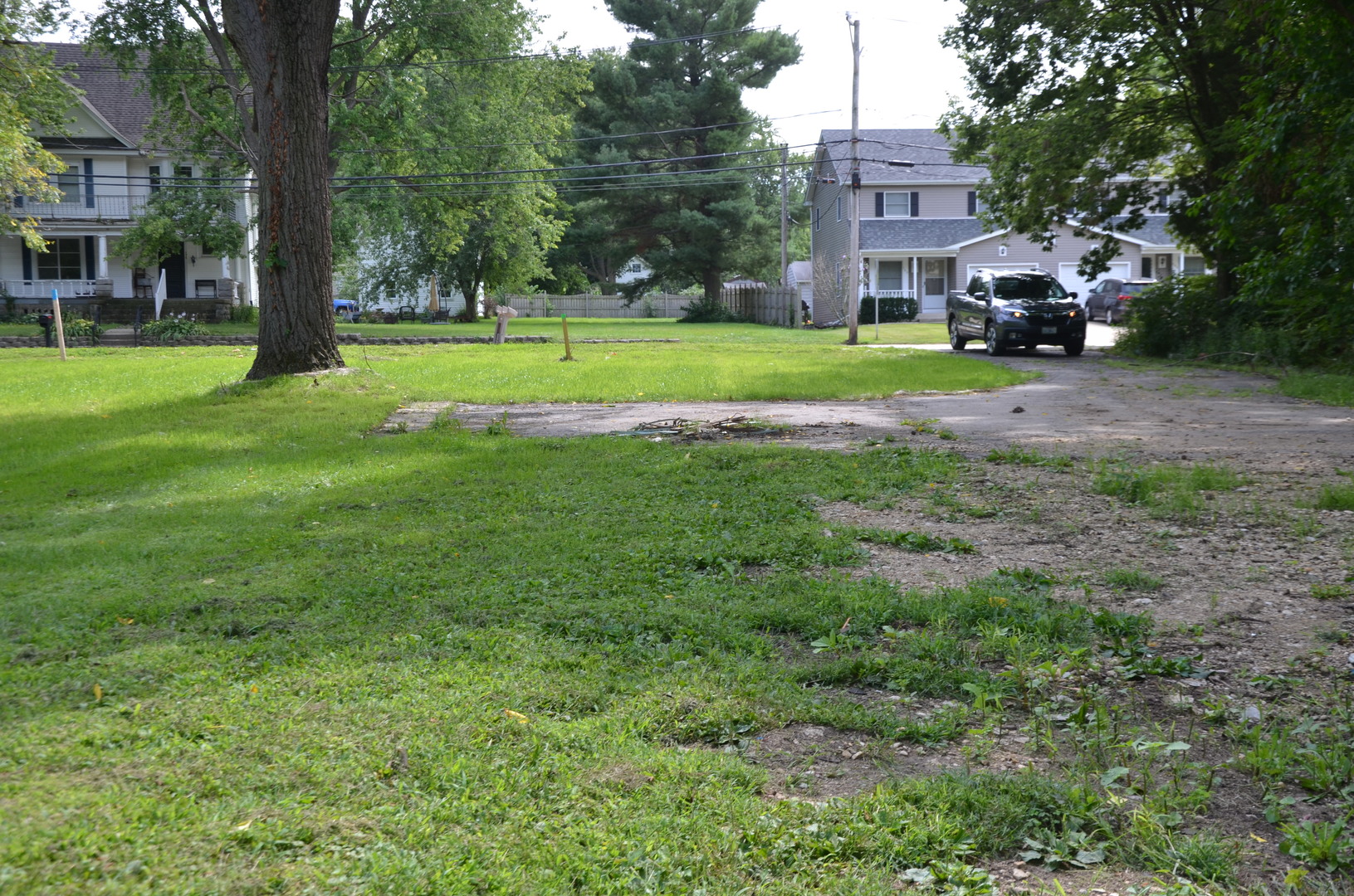 170 Chicago Road Oswego, IL 60543 - Photo 6 of 9 a view of a big house with a big yard and large trees