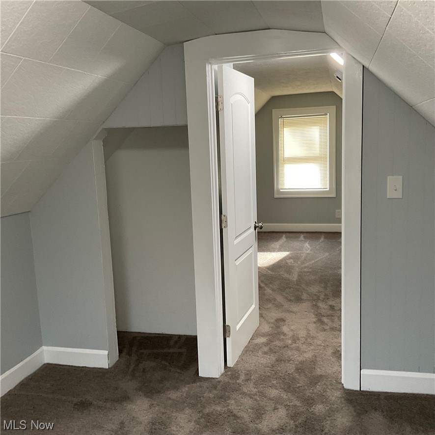 1058 Yellowstone Road Cleveland Heights, OH 44121 - Photo 14 of 28 Bonus room with lofted ceiling and dark colored carpet