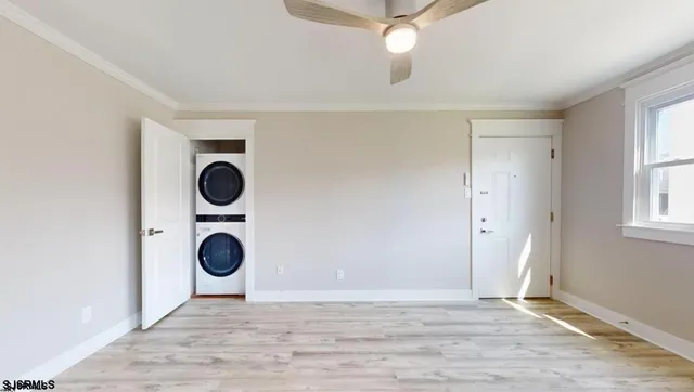 a view of a kitchen with a stove a microwave and cabinets