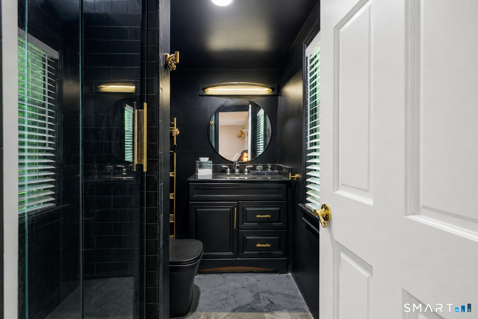 57 Olmstead Road Redding, CT 06896 - Photo 11 of 22 a bathroom with a toilet a light fixture and a sink