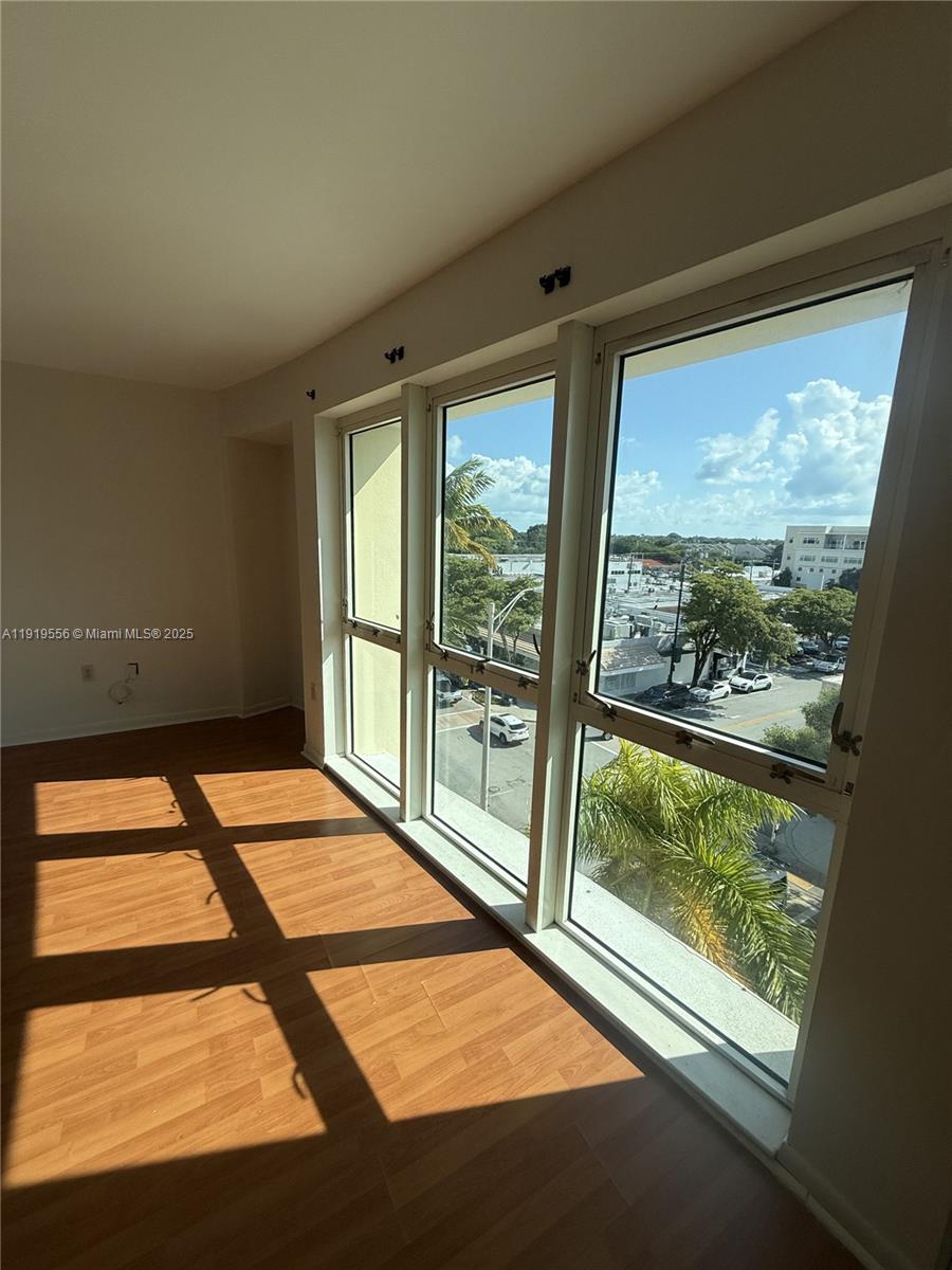 5703 Southwest 72nd Street, Unit 5777 South Miami, FL 33143 - Photo 5 of 6 a room with a large window